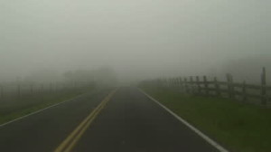 stock-footage-driving-heavy-dense-fog-through-rural-farm-road-driving-point-of-view-a-car-or-vehicle-on-a-foggy